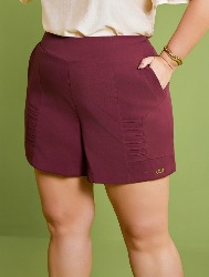 SHORT COM BOLSOS RECORTADOS COM VIÉS